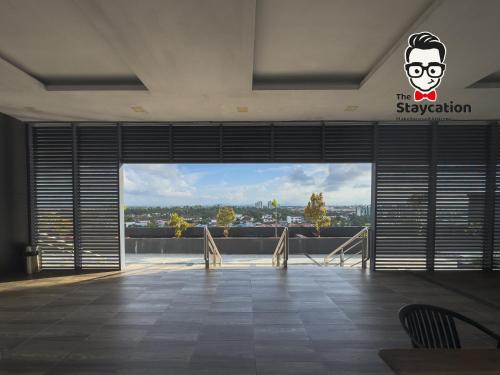 a large room with a view of a city at Staycation Homestay 38 Viva J2 near Tabuan in Kuching