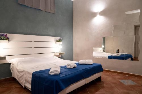 Un pat sau paturi într-o cameră la VILLA PIRANDELLO