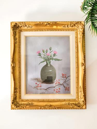 a painting of a vase with flowers in it at Mossy Forest Family Retreat II, 2-8 pax, Cameron Highlands in Cameron Highlands