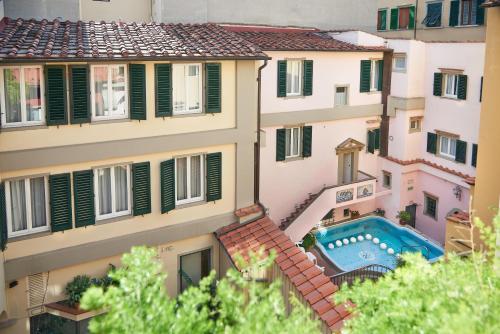 an overhead view of a building with a swimming pool at Rivoli Boutique Hotel in Florence