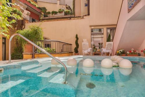a swimming pool in the middle of a building at Rivoli Boutique Hotel in Florence