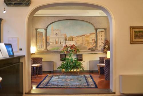 an archway in a room with a painting on the wall at Rivoli Boutique Hotel in Florence