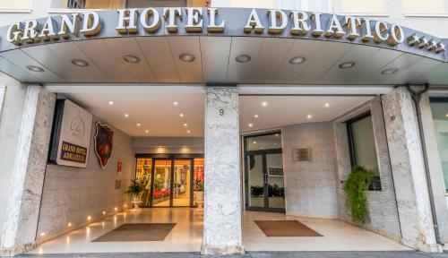 a building with a sign that reads grand hotel antioch at Grand Hotel Adriatico in Florence