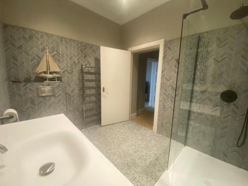 a bathroom with a shower and a sink at WM Apartments in Edinburgh