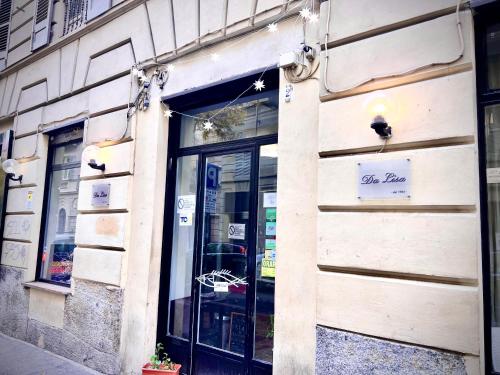 a store with a sign on the side of a building at B&B Da Lisa in Turin