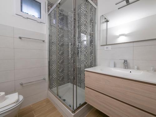 a bathroom with a shower and a sink and a toilet at I Host Apartment - Forlanini 1 in Milan