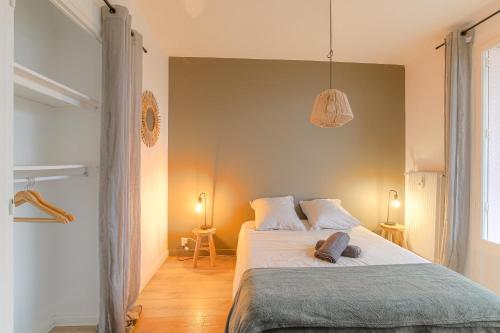 Postel nebo postele na pokoji v ubytování Charcot Appartment
