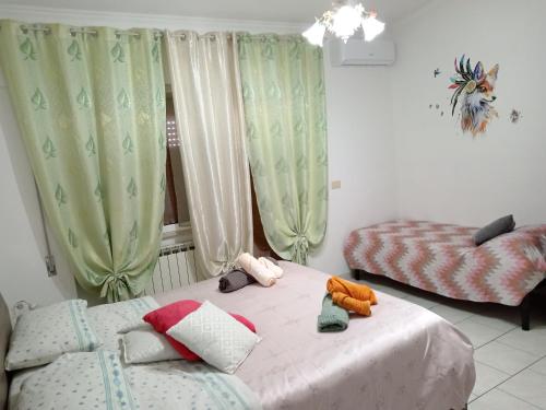 Postel nebo postele na pokoji v ubytování Nomentum House