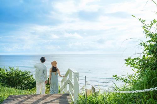 a couple looking out at the ocean at Shimoda Prince Hotel in Shimoda
