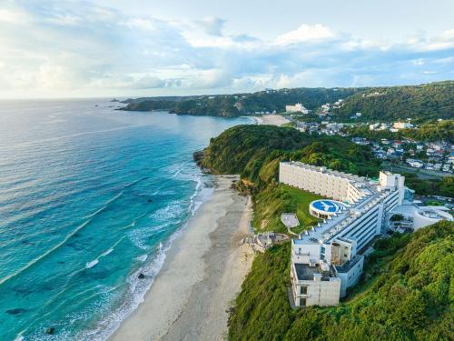 an aerial view of a beach and the ocean at Shimoda Prince Hotel in Shimoda