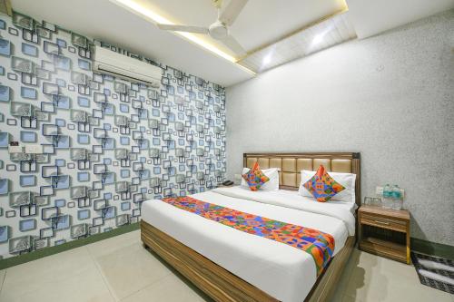 Letto o letti in una camera di FabHotel Ess Pee Grand