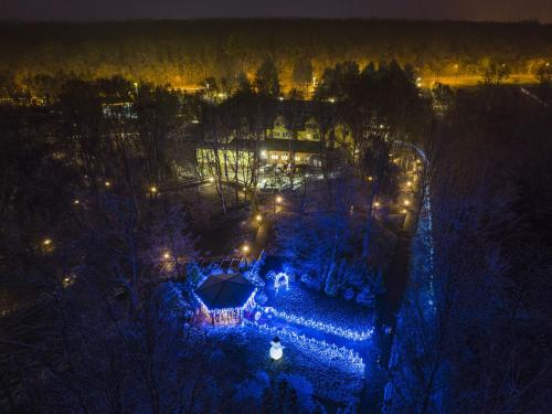 an overhead view of a garden at night with lights at Hotel Sylwia in Sośnicowice