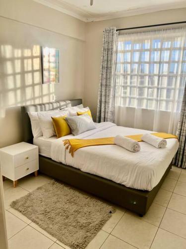 En eller flere senge i et værelse på The Cozy Haven