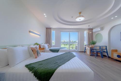 Giường trong phòng chung tại Phuc Lam Hotel & Apartment