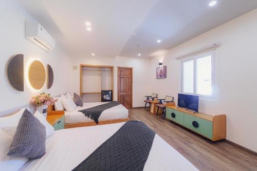 Ένα ή περισσότερα κρεβάτια σε δωμάτιο στο Phuc Lam Hotel & Apartment
