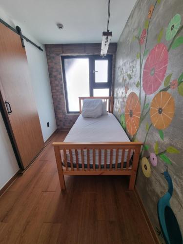 Un ou plusieurs lits dans un hébergement de l'établissement Hwon Guesthouse