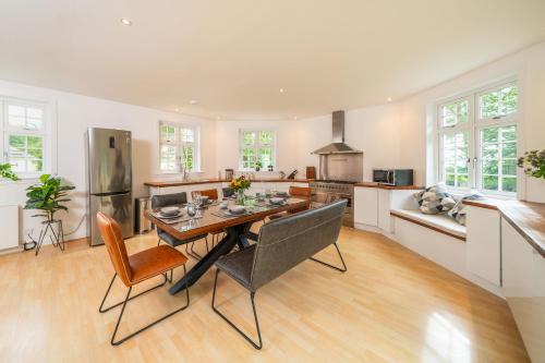 a kitchen with a table and chairs in a room at The Bensil in Carnoustie