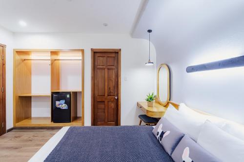 Ένα ή περισσότερα κρεβάτια σε δωμάτιο στο Phuc Lam Hotel & Apartment
