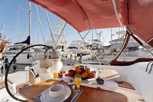 a table with a plate of fruit on a boat at Pato Lucas Sail Boat in San Sebastián de la Gomera
