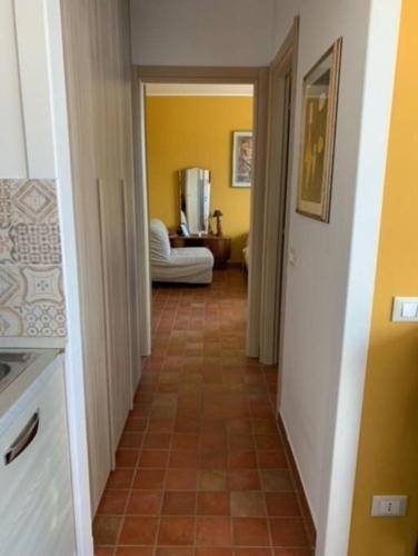 a hallway with a tile floor in a house at [Appartamento Girasole] in Varzi