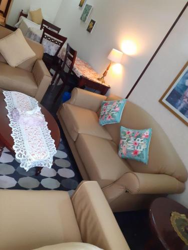 a living room with a couch and a table at Fantastic appartment at times square Kuala Lumpur in Kuala Lumpur