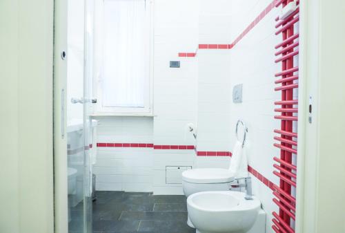 a bathroom with a toilet and a sink at Suite 52 Trastevere in Rome