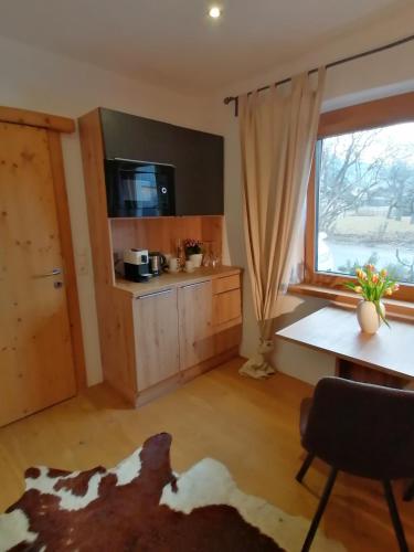 a living room with a cow laying on the floor at Haus Miriam in Mieming