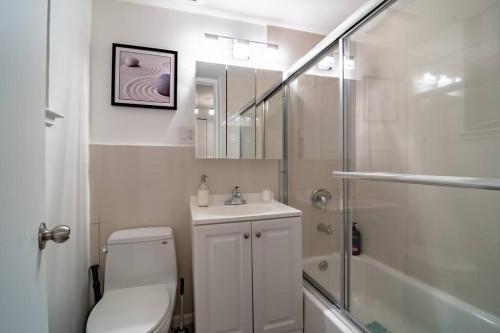 a bathroom with a toilet and a sink and a shower at Japanese themed 2bedroom in Gold Coast for up to 4 guests with optional Valet parking in Chicago