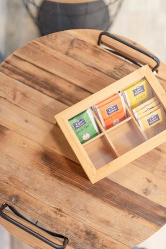 a wooden box on top of a wooden table at Zama Suites in Zakynthos Town