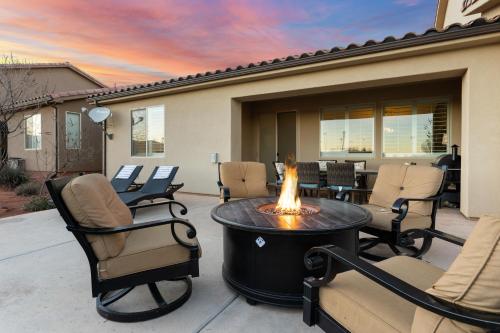a fire pit on a patio with chairs and a table at Desert Moose #75 townhouse in Santa Clara