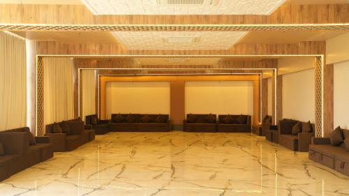 a large room with couches and a large wall at The Sky Imperial Sethji Ni Wadi in Indore
