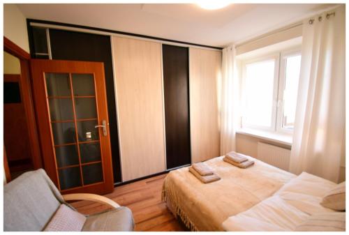 Ένα ή περισσότερα κρεβάτια σε δωμάτιο στο Color 24 Apartament V