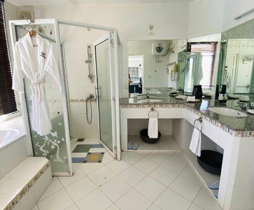 a bathroom with a shower and a sink at An Hoa Residence in Long Hai
