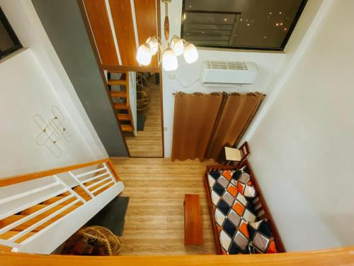 an overhead view of a staircase in a house at The River House - Loft Units in Vigan