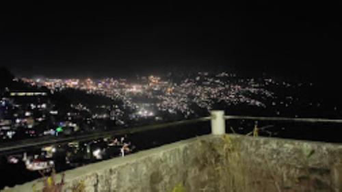 a view of a city at night at Riva Homestay and Restaurant , Darjeeling in Darjeeling