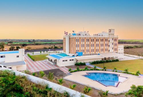 an aerial view of the resort with a swimming pool at The Orchid Jamnagar in Jamnagar