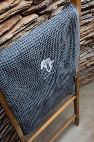 a wicker chair with a sticker on the back of it at Africa House in Hoedspruit