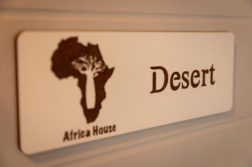a sign for an atlas house with an africa house at Africa House in Hoedspruit