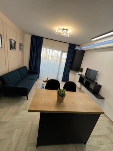 a living room with a couch and a table at Sunny Apartments Avanera Suceava in Suceava