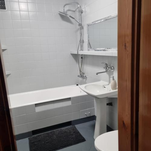 a bathroom with a sink and a tub and a toilet at WILLA MIŁA in Stalowa Wola