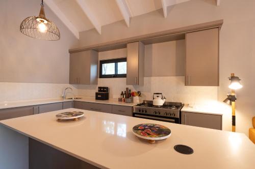 a kitchen with a counter top with a plate on it at Africa House in Hoedspruit