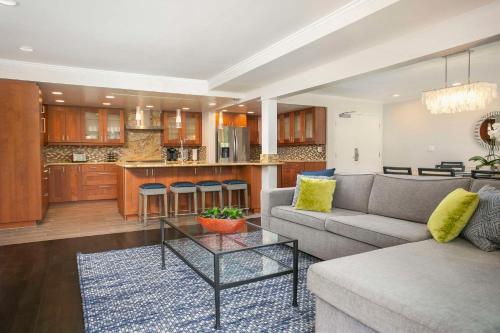 a living room with a couch and a table at Hyatt Regency Newport Beach in Newport Beach