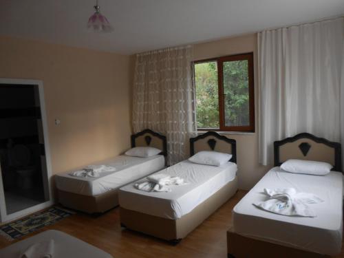 Postel nebo postele na pokoji v ubytování Taurus Guest House