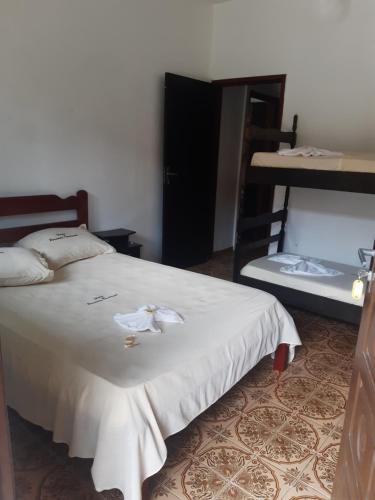 Cama ou camas em um quarto em Pousada Pantanal