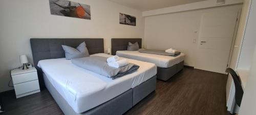 Ένα ή περισσότερα κρεβάτια σε δωμάτιο στο Noahs Apartments