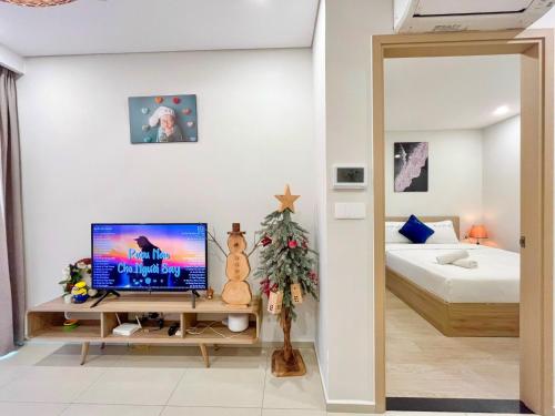 Телевизор и/или развлекательный центр в MeoMeo Homestay - The Sóng Apartment