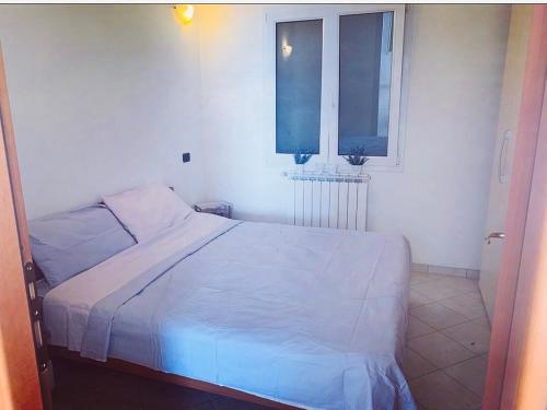 En eller flere senge i et værelse på Bella Vista Poggi - 180 Grad fantastischer Meerblick & Pool