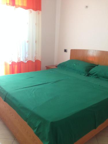 Postel nebo postele na pokoji v ubytování Villa George