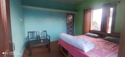Posteľ alebo postele v izbe v ubytovaní Nitwal Home Stay