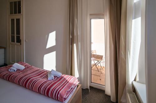 Postel nebo postele na pokoji v ubytování Stodolní Apartment